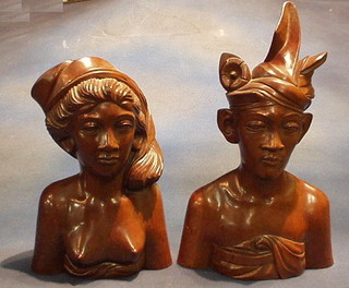 A pair of Eastern carved head and shoulders hardwood busts Lady and Gentleman 15"