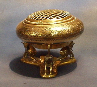 A circular benares brass rose bowl and spreader raised on 3 elephant supports 10"