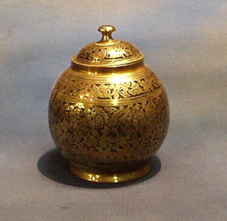 A circular benares brass jar and cover 9"