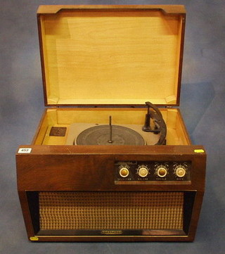 A Dynatron Mazurk record player contained in a walnutwood case