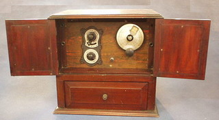 An early radio contained in a mahogany case