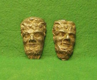 A pair of cherub lead masks in the form of Bacchus 4" and a carved alabaster plaque in the form of a lady's head