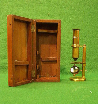 A 19th Century  brass single pillar students microscope in a mahogany case