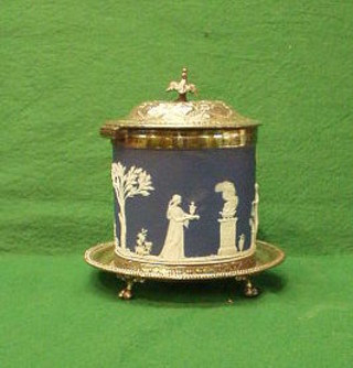A Wedgwood blue Jasperware biscuit barrel with silver plated mounts, impressed Wedgwood England