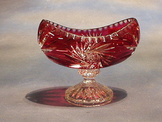 A ruby cut glass boat shaped pedestal bowl 8"