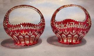 A pair of cut ruby glass baskets 10"