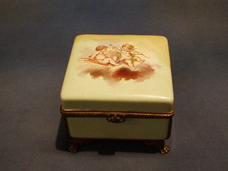 A 19th Century Continental porcelain trinket box with hinged lid and gilt metal mounts, decorated cherubs (r) 6"