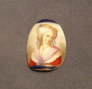 An 18th/19th Century convex oval porcelain plaque depicting a head and shoulders portrait of a young lady 3"