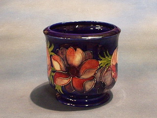 A Walter Moorcroft hibiscus patterned jardiniere, the base with signature mark and impressed Moorcroft England, 7"