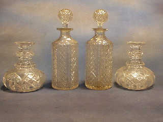 2 squat glass decanters (no stoppers) and 2 cylindrical cut glass decanters and stoppers