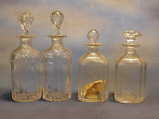 A pair of circular cut glass decanters and 2 plain cut glass spirit decanters