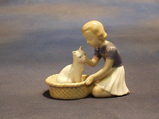 A Royal Copenhagen porcelain figure of a kneeling girl with cat in basket, base marked B & G 2219, 4"