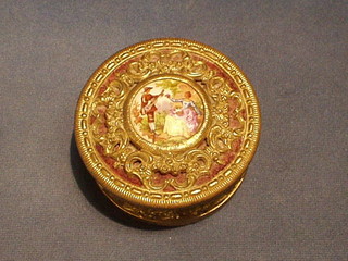 A circular pierced gilt metal trinket box with hinged lid inset a porcelain plaque 4"