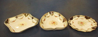 A 12 piece Wedgwood porcelain dessert service with floral decoration, blue and gilt banding with two 9 1/2" heart shaped dishes, an 11" oval shaped dish, two 8" square dishes and 7 circular plates 8" (2 cracked), the bases marked Wedgwood England X3848M