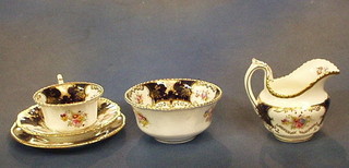 A 40 piece Coalport tea  service with floral decoration and blue and gilt banding, comprising 2 square twin handled bread plates (1 cracked), sugar bowl, cream jug (cracked), 12 saucers (4 cracked with crazing), 12 cups (4 cracked), 12 tea plates (6 cracked)