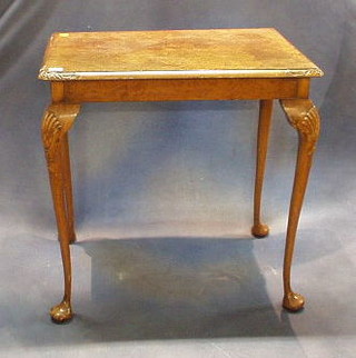 A Queen Anne style rectangular walnutwood table raised on cabriole supports 27"