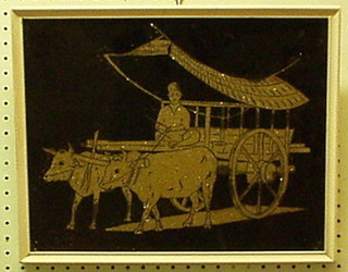 An Eastern silver paper picture "Figure Driving a Bullock Cart" 11" x 14"