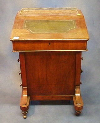 A Victorian inlaid walnutwood Davenport with brass three-quarter gallery, a tooled leather writing surface the pedestal fitted an inkwell drawer above 4 long drawers, 21"