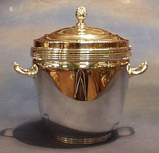 A silver plated twin handled ice bucket and cover