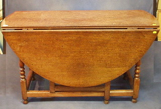 A 17th/18th Century honey oak drop flap gateleg dining table, fitted a frieze drawer and raised on turned and block supports 49"