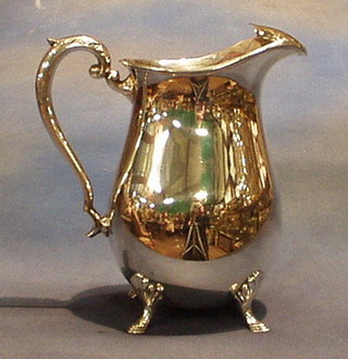 A silver plated lemonade jug