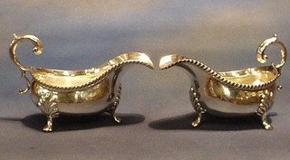 2 large silver plated sauce boats with gadrooned borders and C scroll handles