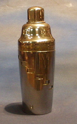 A 1930's Art Deco silver plated cocktail shaker, the side engraved with various recipes