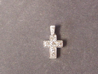 A white gold cross set 8 diamonds (approx .0.87ct)