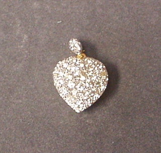 A lady's gold heart shaped pendant set numerous diamonds (approx 1.91ct)