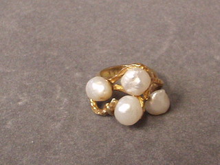 A 14ct gold dress ring set 4 pearls