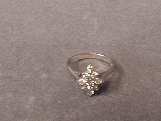 An 18ct white gold dress ring set 9 diamonds