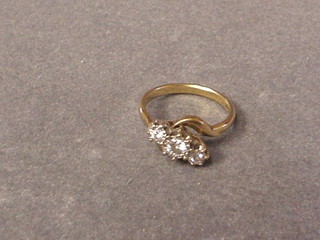 A lady's 9ct gold dress ring inset 3 diamonds