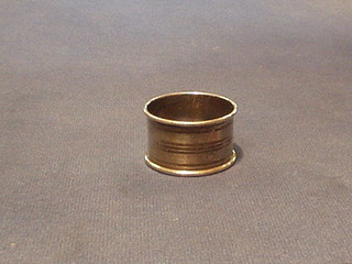 An engraved silver napkin ring