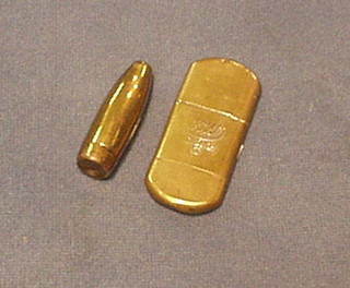 A brass petrol lighter marked DRP and a brass trench art vesta case