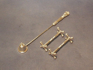 An American Sterling silver candle snuffer and a pair of knife rests (3)