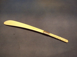 A carved ivory shoe horn 16"