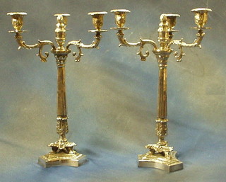 A pair of large and impressive silver plated 3 light candelabrum, raised on reeded columns and with triform bases 19"