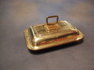 A rectangular silver plated entree dish and cover