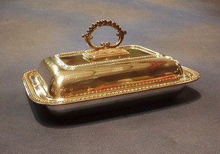 A rectangular silver plated entree dish and cover