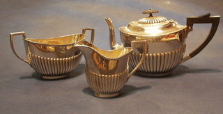 A Britannia metal 3 piece tea service with teapot, twin handled sugar bowl and cream jug