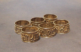 6 Eastern silver napkin rings