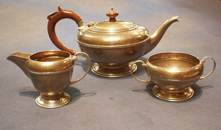 A 3 piece circular silver tea service Birmingham 1962 27 ozs