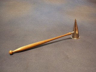 A silver plated candle snuffer with turned beech handle