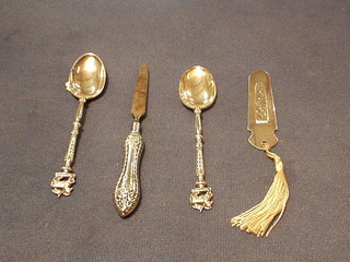 A silver bookmark, 2 silver spoons with Queen Regt. badge and a similar handled nail file