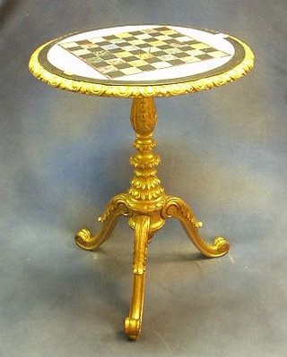 A carved gilt wood circular pedestal table, the top inlaid a specimen marble chessboard 24"