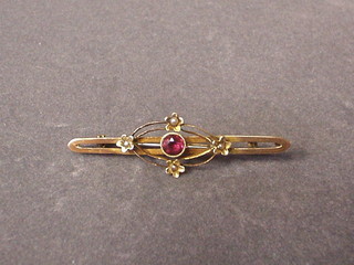 A Victorian 9ct gold bar brooch set pearls and pink coloured stone