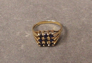 A 9ct gold ring set 9 sapphires