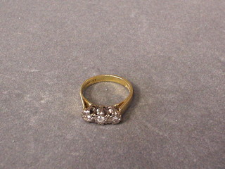 A lady's 9ct gold 3 stone illusion set diamond engagement ring