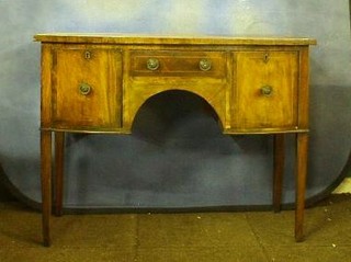 A Georgian mahogany bow front sideboard, fitted 1 long drawer flanked by a pair of cupboards raised on square tapering supports 44"