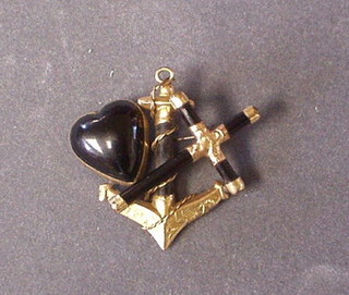 A Victorian gilt metal and black hardstone mourning brooch depicting Faith Hope and Charrity